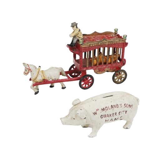 988 - Collectibles:  An original miniature cast iron Model, of a pig for coins, with advertisement 