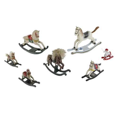 1018 - A collection of painted miniature Rocking Horses. (1)