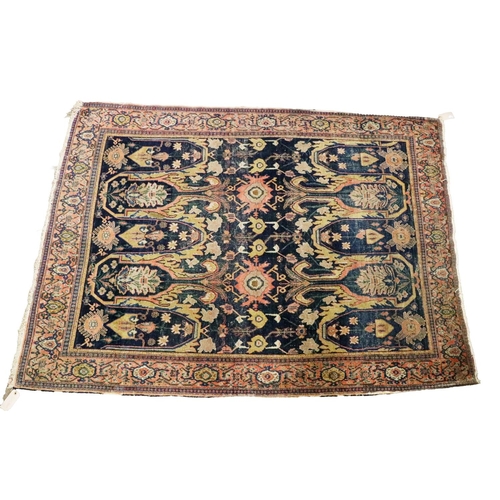 439 - An attractive 19th Century woollen Rug, Middle Eastern, the navy ground centre with large stylized f... 