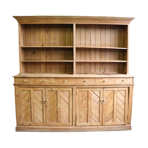 560 - A fine quality 19th Century Irish pitch pine Dresser, the moulded cornice over divided shelved top o... 