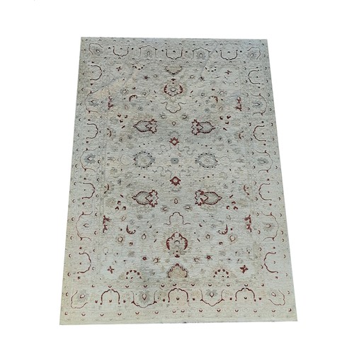 440 - A large impressive late 19th Century 'Ziegler' cream ground woollen Carpet, the central section with... 