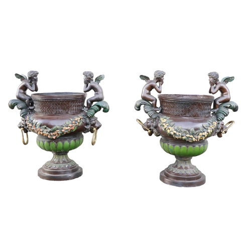 448 - A pair of attractive painted metal Urns, each with wave design handles with seated winged cherubs, w... 