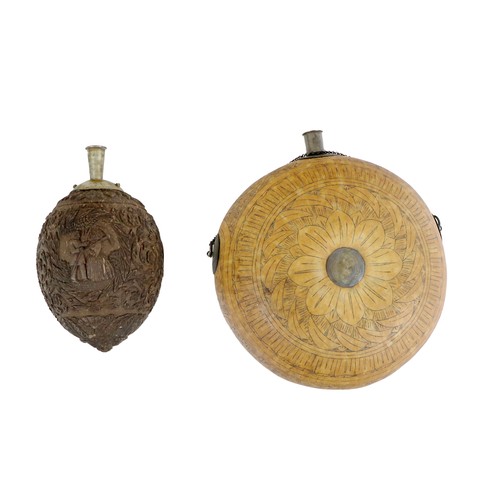 161 - An early 18th Century Dutch carved coconut Powder Flask, decorated with overall floral design, figur... 