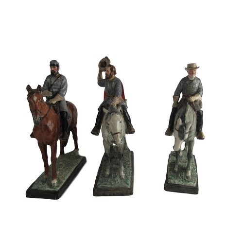 1002 - Kathleen Wheeler, British (1884-1977)A group of three hand painted porcelain Figures, heroes of Amer... 