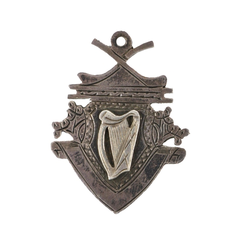 967 - Medal: G.A.A., Hurling, (Co. Cork) 1964, a shield shaped silver Medal, the obverse with crossed hurl... 