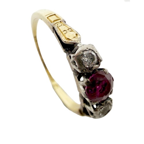 1115 - A gold Ladies Ring, with central ruby type stone flanked with diamonds either side, ring size approx... 