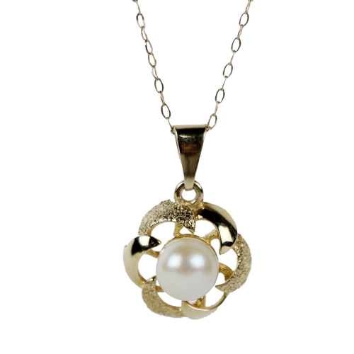 1128 - An attractive Ladies elegant 9ct gold Chain, with a shaped circular pendant with freshwater pearl se... 