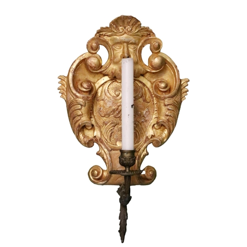 12 - A pair of George II style carved giltwood cartouche shaped Candle Wall Lights, each with a grotesque... 