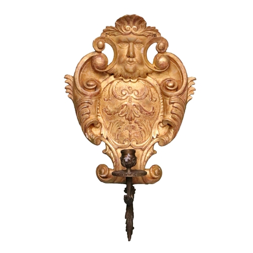 12 - A pair of George II style carved giltwood cartouche shaped Candle Wall Lights, each with a grotesque... 