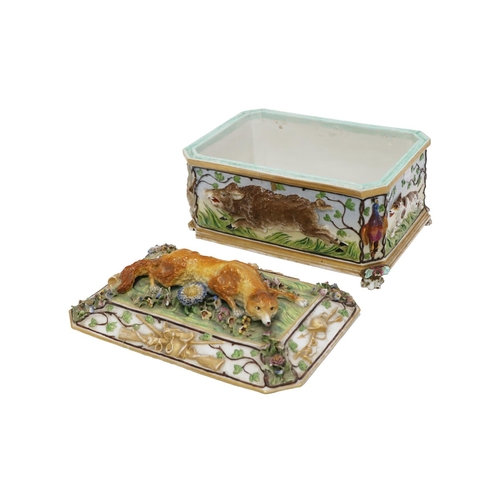 37 - A rectangular relief moulded Continental porcelain Casket with cover, depicting hunting tr... 