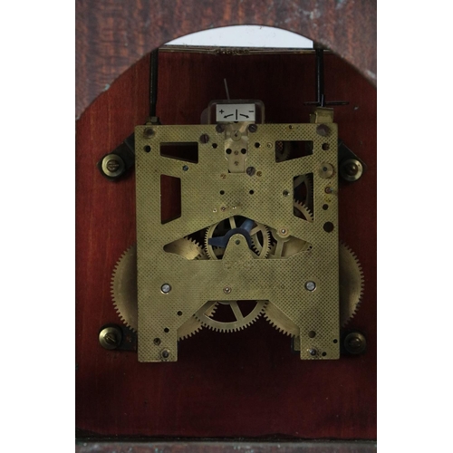 7 - A Georgian style mahogany Bracket Clock, with brass carrying handle, the face with exposed chime abo... 