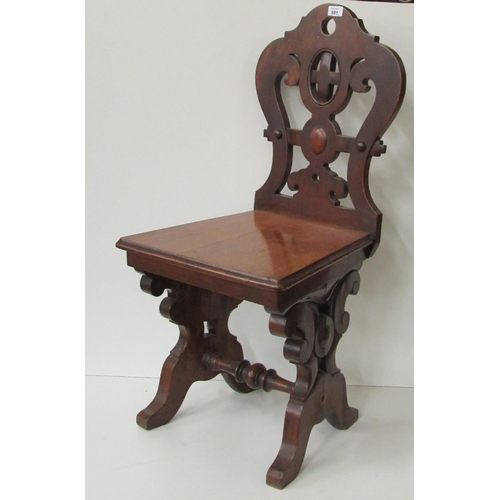 409 - An Irish heavy carved and pierced Victorian oak Hall Chair, in the manner of Strathan. (1)... 