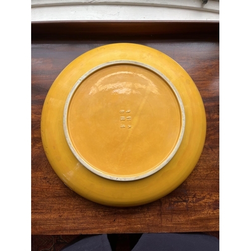 410 - A fine early Chinese Imperial yellow porcelain Dish, with raised enamel features depicting five drag... 