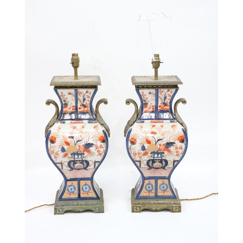 156 - A pair of Imari style baluster vase shaped brass mounted Table Lamps, each with two cast leaf scroll... 