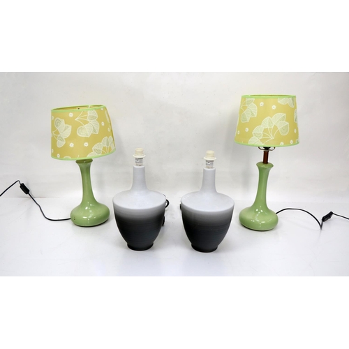 157 - A pair of lime green Table Lamps, with leaf design shades, together with a pair of two tone black an... 