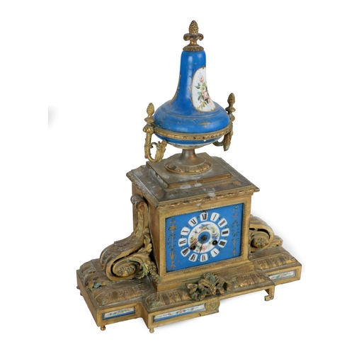 223 - A late 19th Century French gilt Spelter Mantle Clock, with Serves style Celeste blue porcelain urn f... 