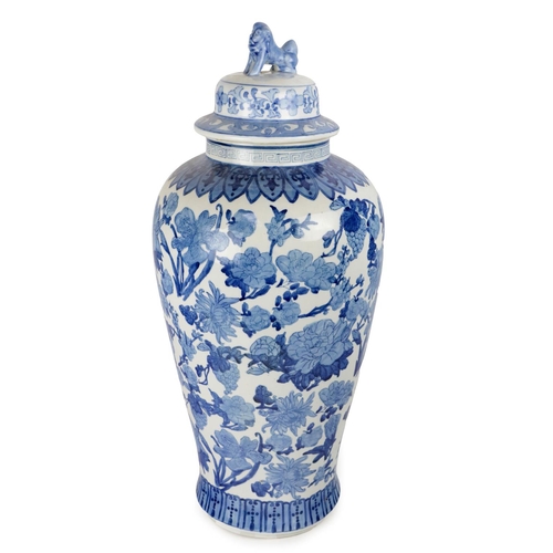 227 - A tall Chinese blue and white baluster shaped Vase and Cover, with all over floral pattern, the cove... 