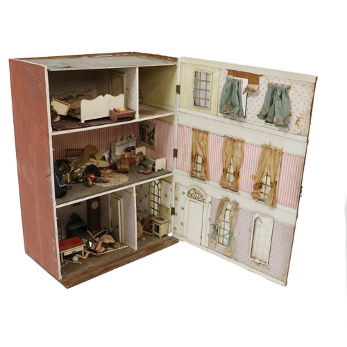 242 - A good three bay three storey Dolls House, with numerous furniture, pictures, dolls, appliances, etc... 