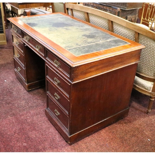 296 - An Edwardian oak kneehole Desk, in the manner of Jas. Shoolbred, the gilt tooled leather inset top a... 
