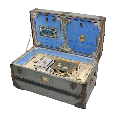 301 - An old metal and wood bound Steamer Trunk, the fitted interior with various compartments, containing... 