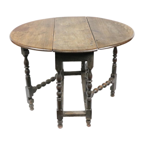 383 - An oak 19th Century gate leg Table, with demi-lune flaps on barley twist supports, approx. 94cms (37... 