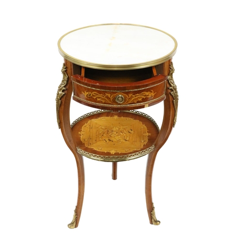 394 - An attractive circular marble top two tier Centre Table,  with moulded brass rim above an inlai... 