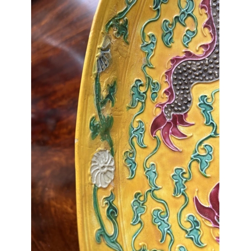 410 - A fine early Chinese Imperial yellow porcelain Dish, with raised enamel features depicting five drag... 