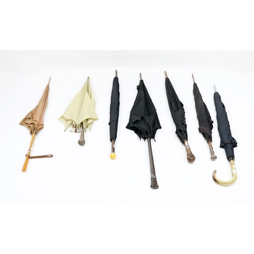 506 - A collection of varied Umbrellas, with ornate handles, as a collection. (7)