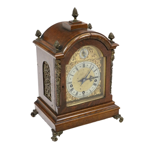 508 - An attractive Edwardian oak cased Mantle Clock, the domed top with multiple brass finials above an a... 