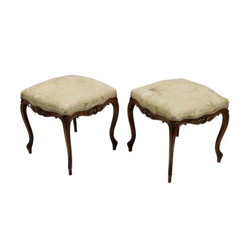 517 - A good pair of late 19th Century carved walnut and parcel gilt Stools, each with a square serpentine... 