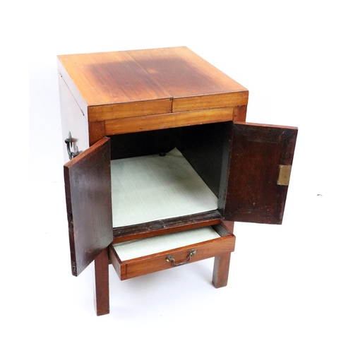 534 - A mahogany Washstand, in the Georgian style, with segmented fold-out top above two cupboard doors an... 