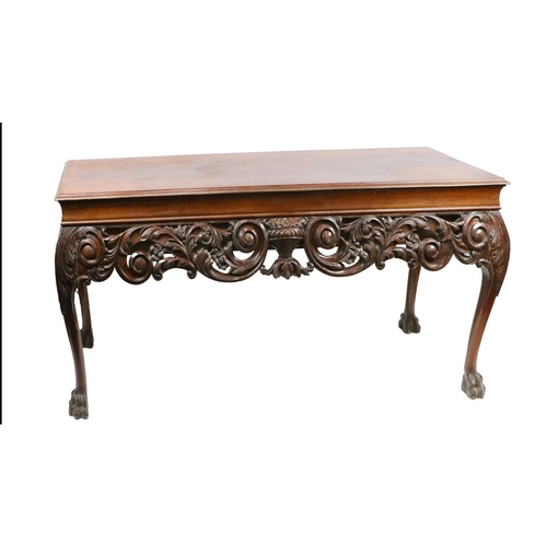 512 - An Irish Georgian style mahogany Side Table, with moulded top over plain frieze issuing ornate carve... 