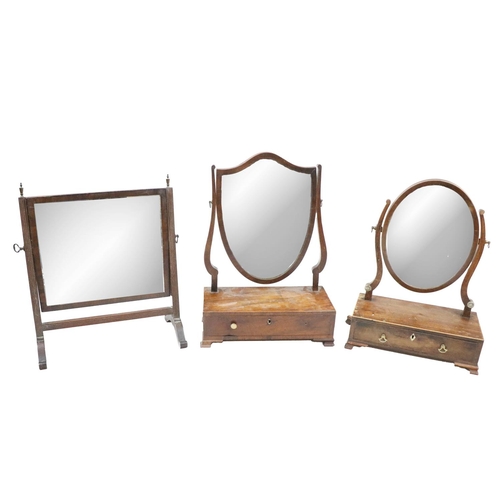 551 - A late George mahogany swing frame Dressing Table Mirror, with oval plate and frieze drawer on ogee ... 