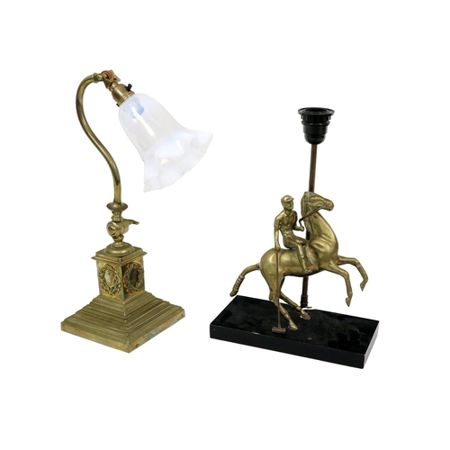 554 - A brass Table Lamp, modelled as a Polo Player on horseback, on an ebonised plinth base; together wit... 
