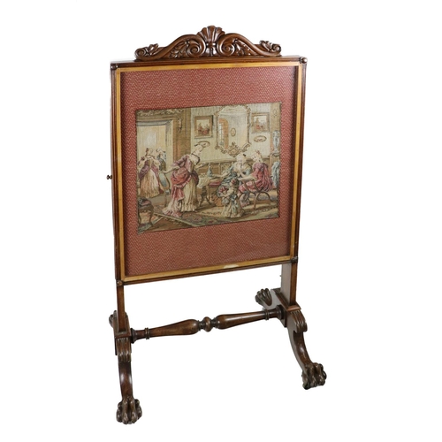 564 - A Victorian mahogany framed tall Firescreen, with carved cornice, inset with a needlework depicting ... 