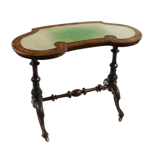 573 - A Victorian walnut and marquetry kidney shaped Ladies Writing Table, on two baluster shaped supports... 