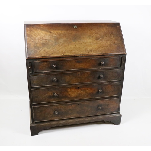 576 - An Irish 19th Century mahogany Bureau, stamped J.Kerr & Co., No. 68931, the slope front opening ... 