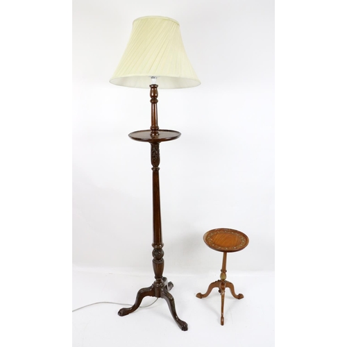 589 - A mahogany Lamp Standard, with cream pleated shade, circular shaped tray top carved and reeded colum... 