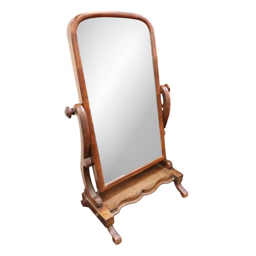 505 - A Victorian mahogany Cheval Mirror, with arched framed glass, with S scroll support on shaped base. ... 