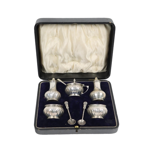 13 - A silver cased Condiment Set, by Gorham Manufacturing Co., Birmingham, comprising salt and pepper, m... 