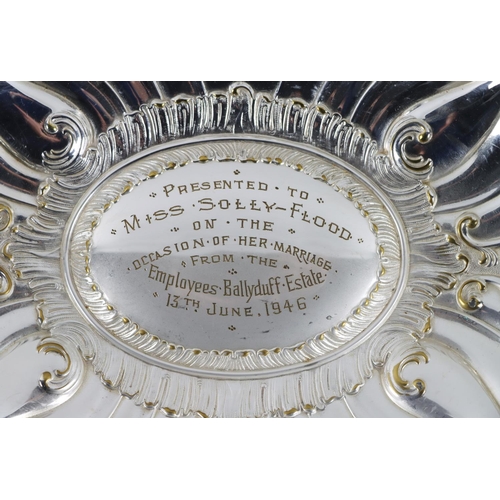 56 - Co. Kilkenny: A large silver plated oval Dish, with 'C' scroll repoussé design, the center section e... 