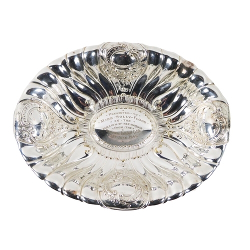 56 - Co. Kilkenny: A large silver plated oval Dish, with 'C' scroll repoussé design, the center section e... 