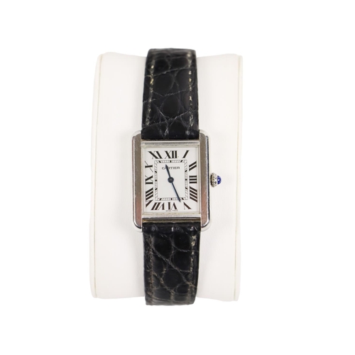175 - A Ladies Cartier Tank Solo Wrist Watch, with steel case, silver dial and Roman numerals, with push/p... 