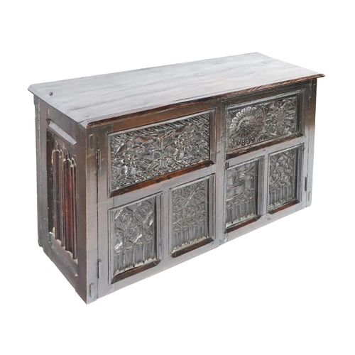 813 - An 18th Century English oak Larder Cupboard, with Gothic style double carved paneled door with four ... 