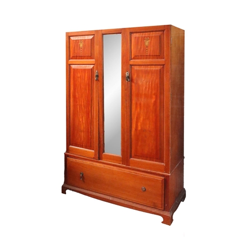 28 - An Edwardian inlaid Wardrobe, with central mirror with large base drawers, 117cms wide (46