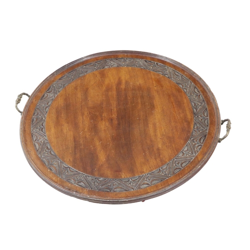 36 - A carved mahogany circular Tray, with brass handles, together with a mahogany and ebony string inlay... 