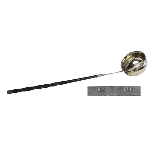 25 - An English silver Georgian period Brandy Ladle, with beaded rim and twist wooden handle, hallmarked ... 
