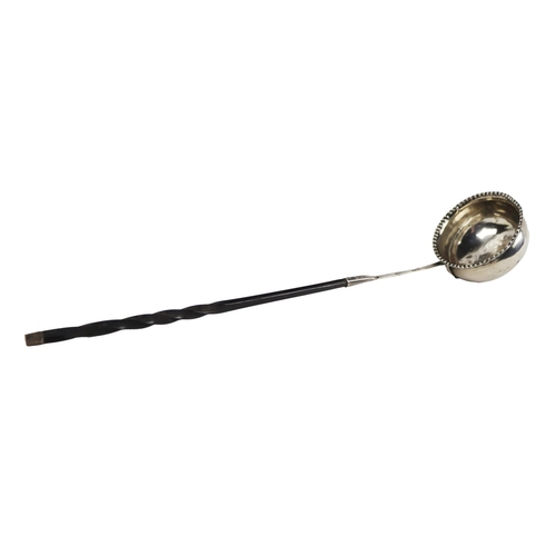 25 - An English silver Georgian period Brandy Ladle, with beaded rim and twist wooden handle, hallmarked ... 