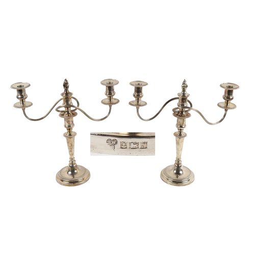 38 - A pair of fine quality Georgian style English silver three light two branch Candelabra, with scroll ... 