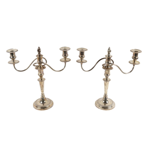 38 - A pair of fine quality Georgian style English silver three light two branch Candelabra, with scroll ... 